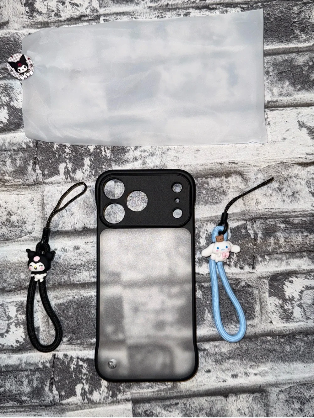 17 Pro Max Phone Case Matte Black featuring Kuromi and Cinnamoroll lanyards.
